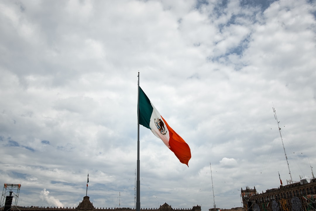 Crowd gathered at a soccer field with police presence