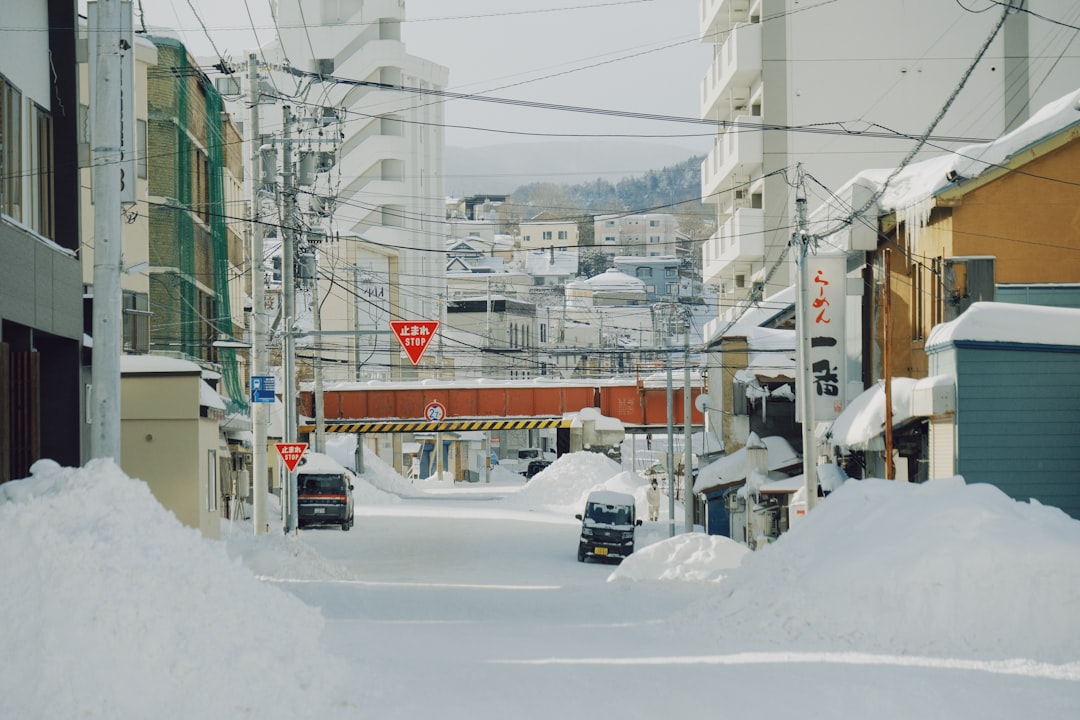 A snow-covered street with downed power lines