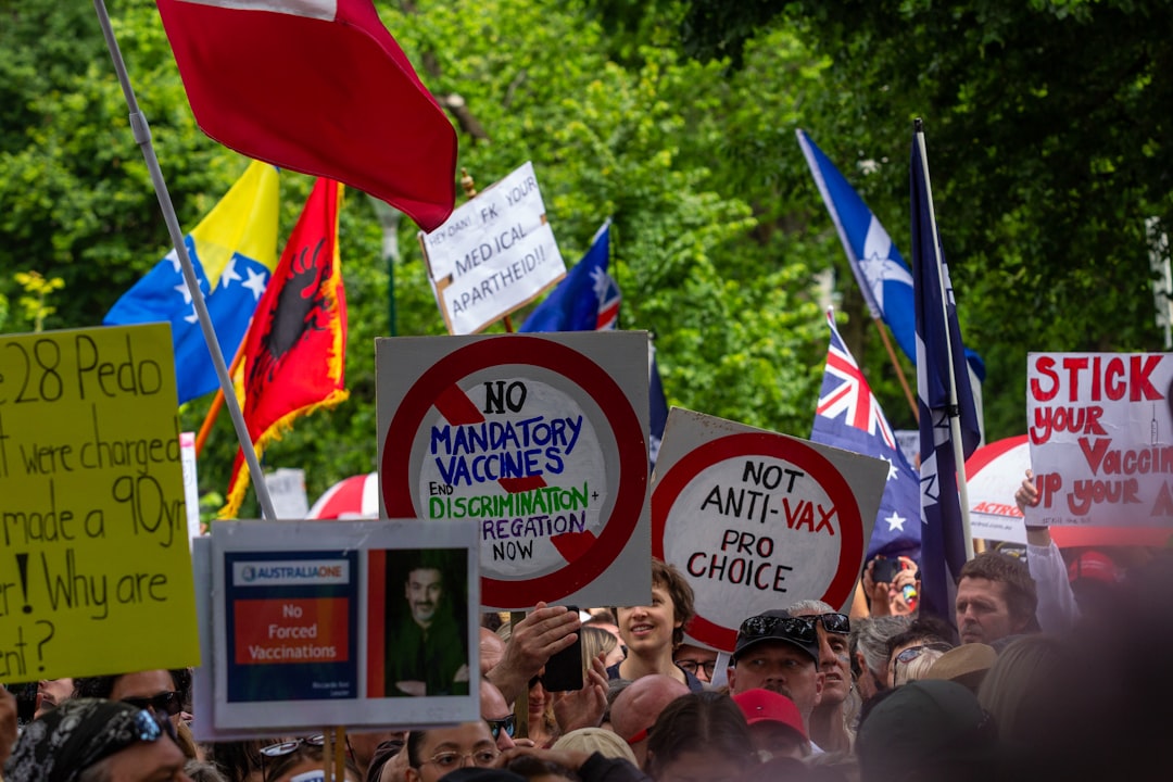 Protesters holding signs against U.S. immigration policies