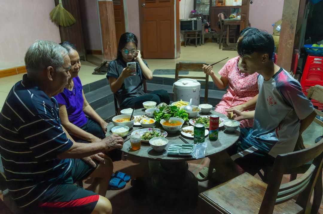 A family gathered around a table enjoying a homemade pot roast