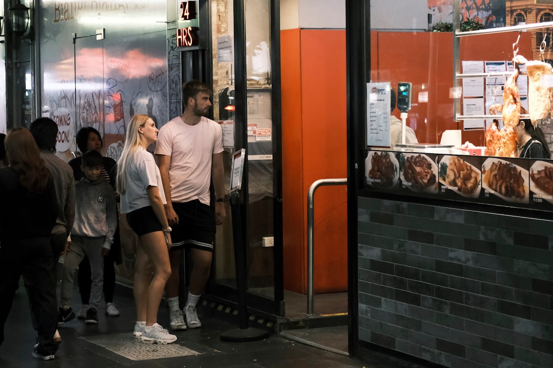 Customers standing outside the burger chain location