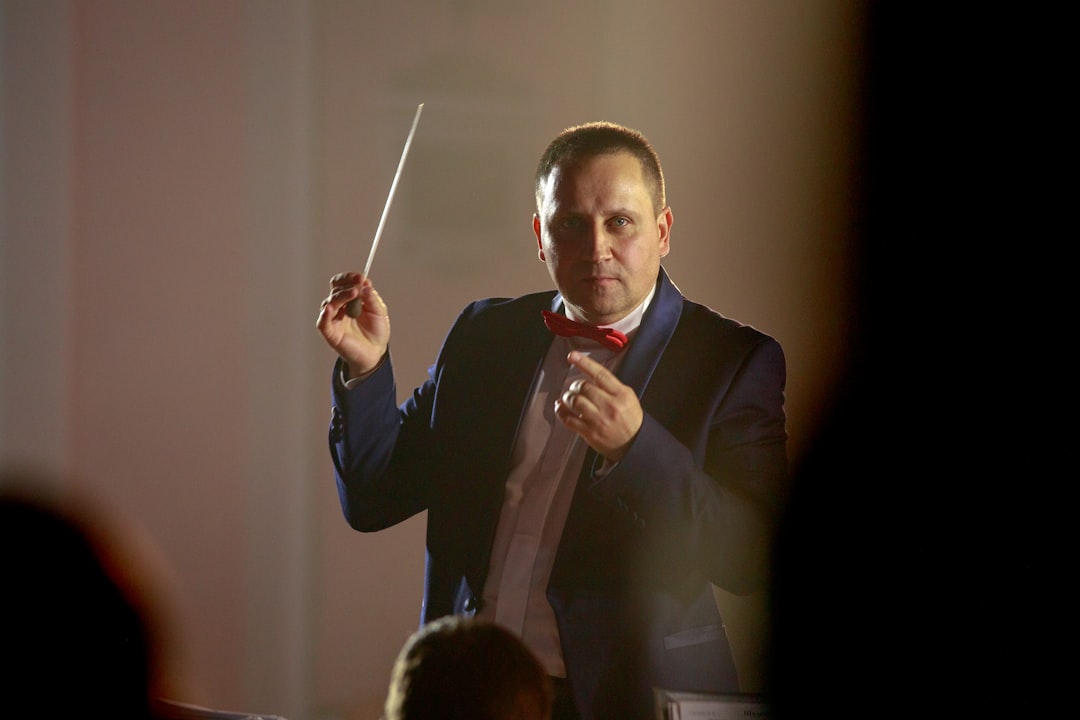 Jennifer Jimenez conducting a school band