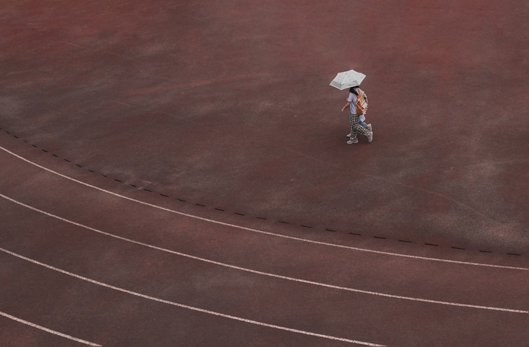 Two athletes racing on a track wearing exoskeletons from Dnsys and Hypershell
