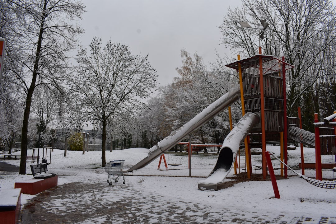 Snow-covered school playground under a clear blue sky