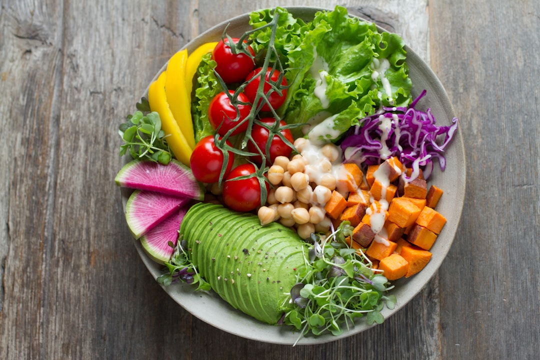 A diverse plate of healthy foods including vegetables, grains, and proteins