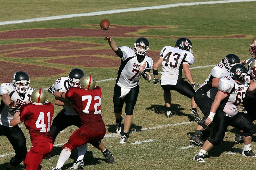 Patriots quarterback throwing a pass during a game