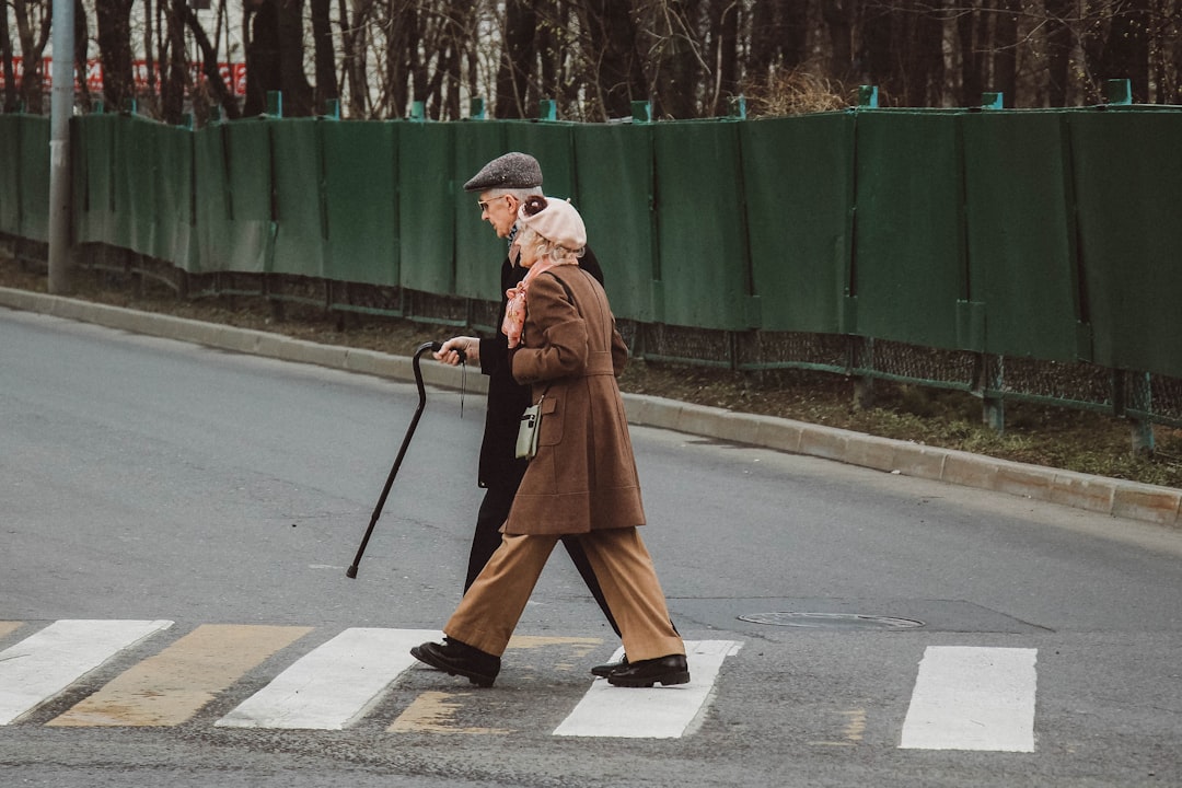 An elderly person doing gardening work, illustrating another form of light physical activity