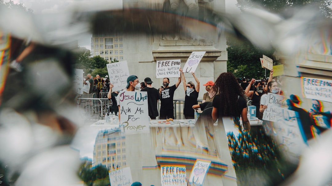 Protesters holding signs demanding justice for Renee Good