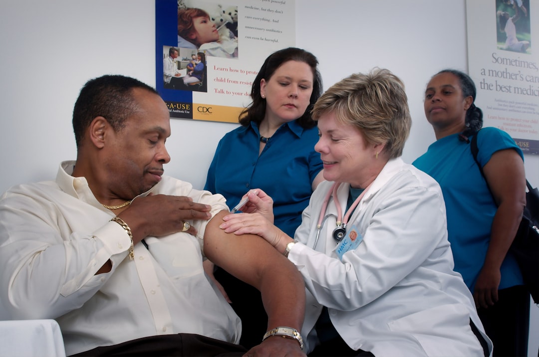 A healthcare worker administering a vaccine to a child