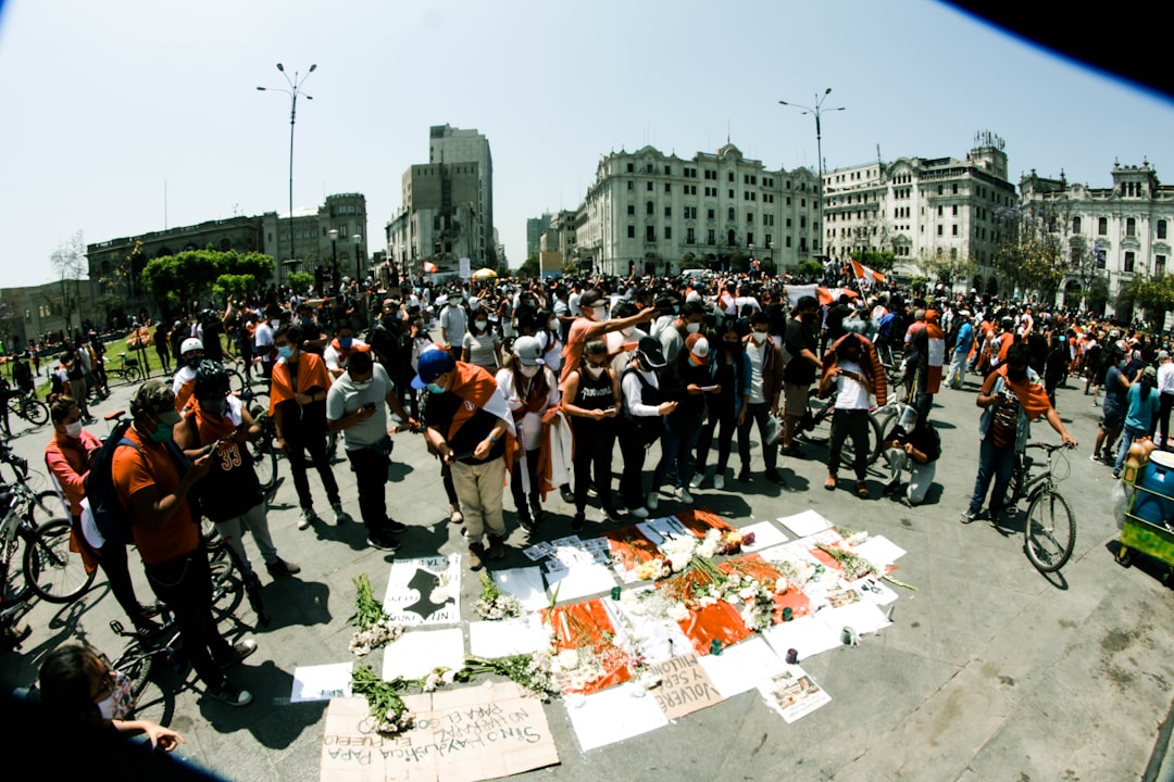 A protest scene with journalists covering the event