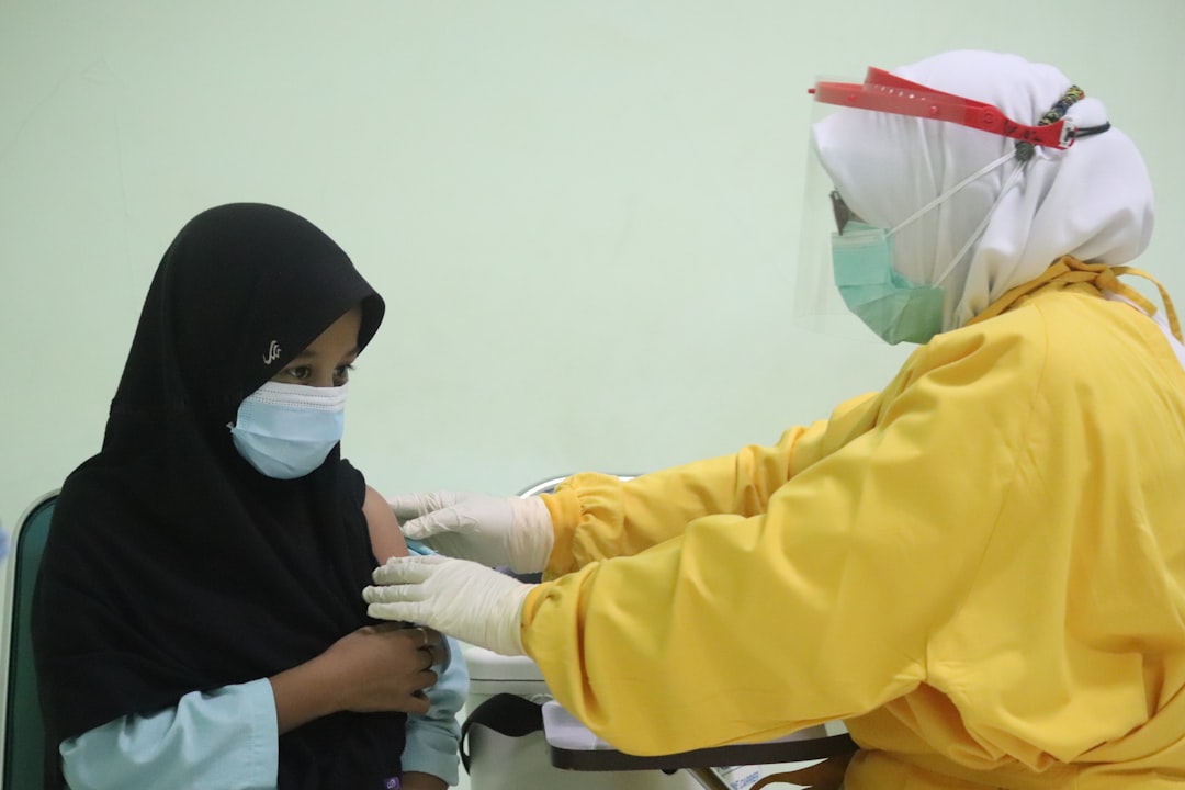 Health officials administering vaccines at a community center