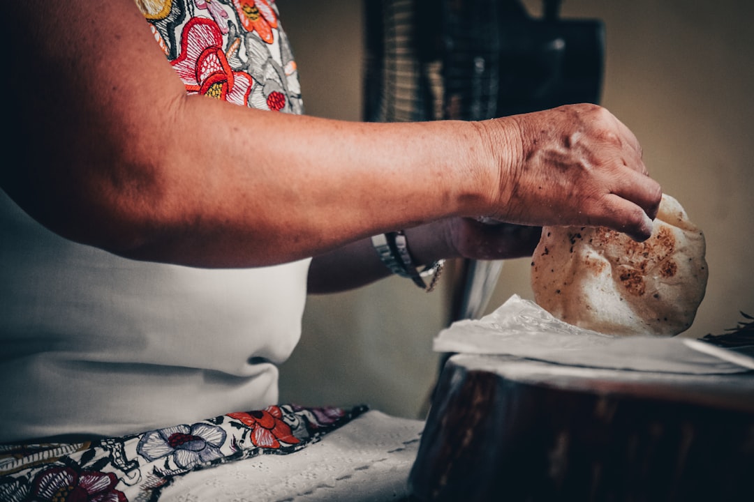 A grandmother teaching her grandchildren how to make homemade soup