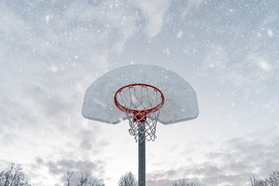 Snow-covered basketball court highlighting the winter storm impact