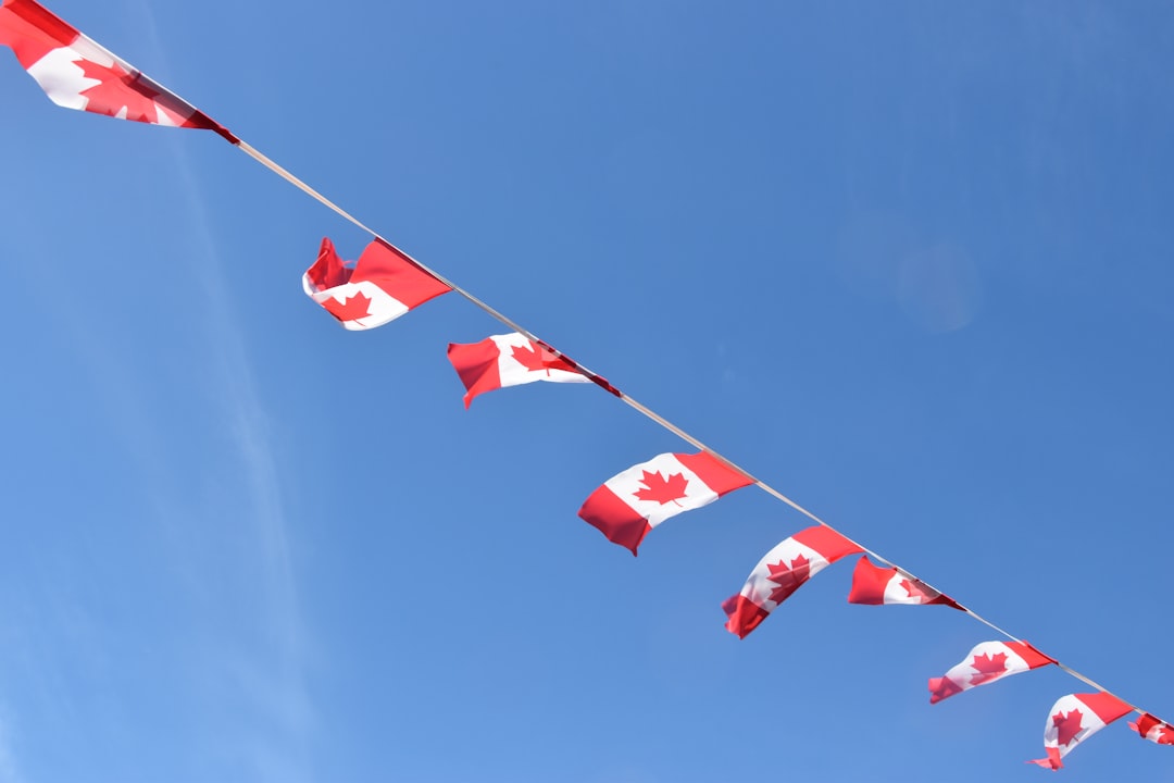 Canadian and Chinese flags during trade agreement signing
