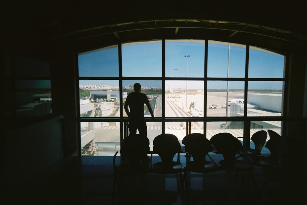 passengers waiting in airport terminal during delay