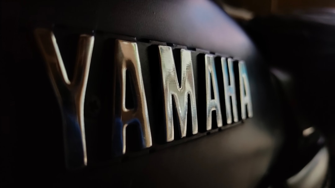 Yamaha logo on a motorcycle and a grand piano