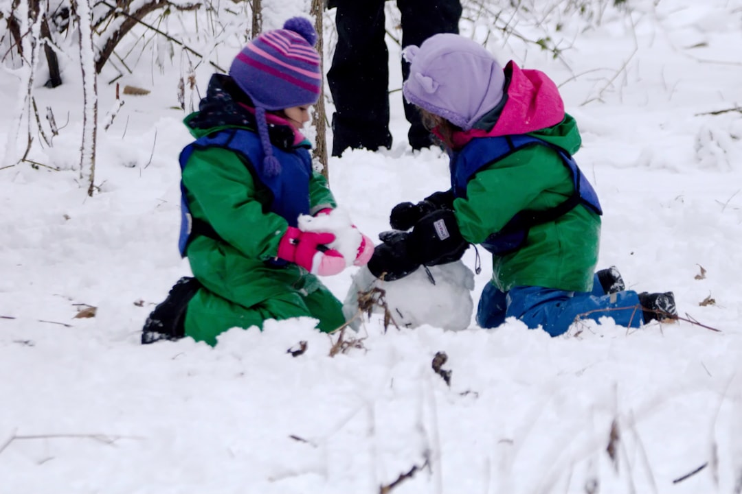 Children playing in the snow during a snow day