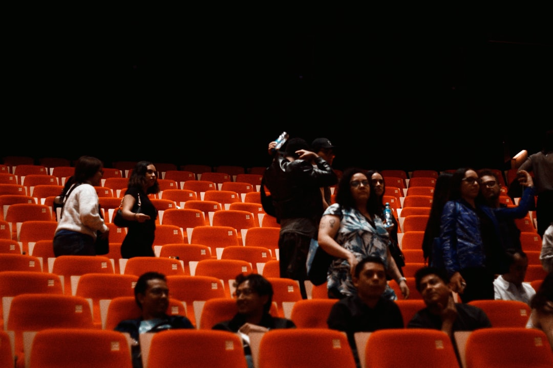 Audience members lining up outside a theater showing the documentary